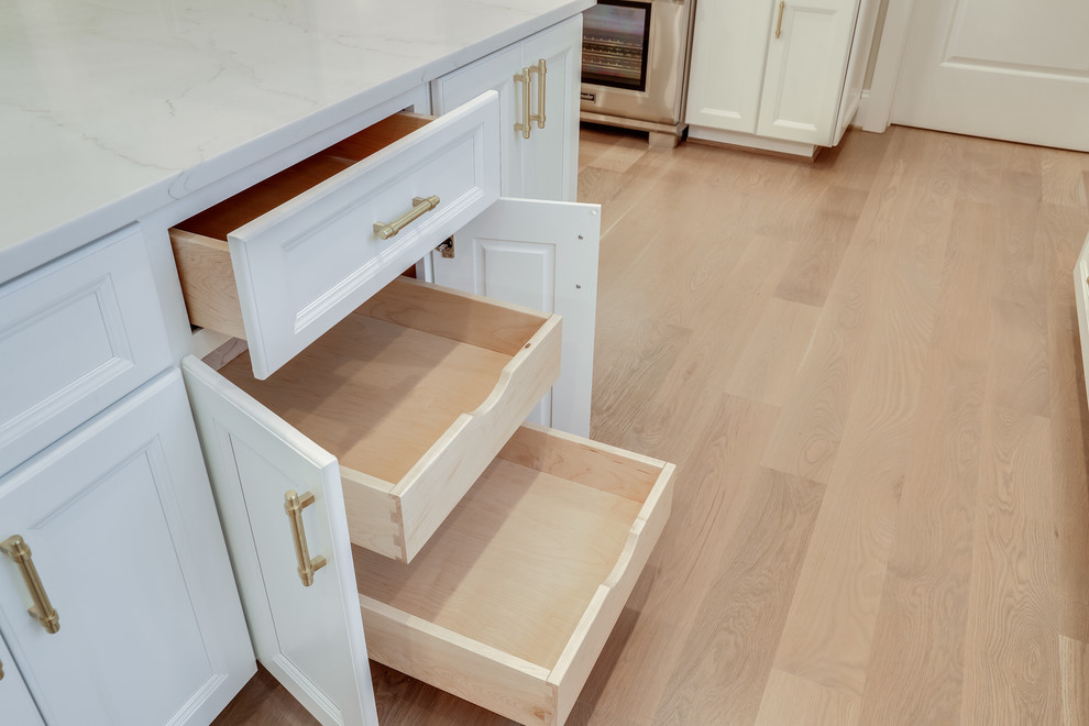 Inspiration for a huge transitional kitchen remodel in Baltimore with flat-panel cabinets, white cabinets, marble countertops, white backsplash, subway tile backsplash, stainless steel appliances and an island