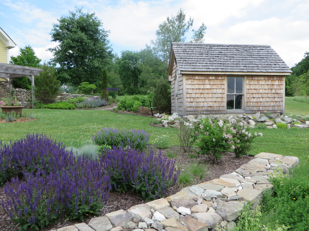 Large mountain style side yard and detached full sun garden shed photo for spring in Boston