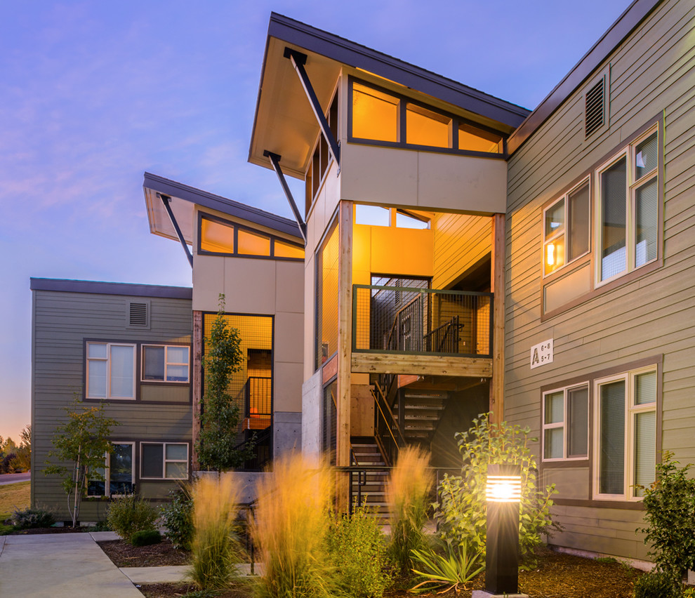 Photo of a contemporary two-storey apartment exterior in Portland.