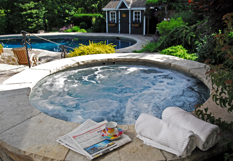 Inspiration for a large rustic full sun backyard stone water fountain landscape in Toronto for summer.