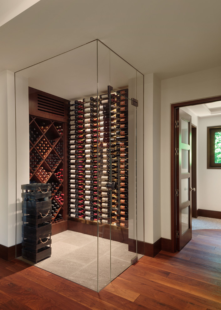 Large contemporary wine cellar in Miami with ceramic floors and display racks.