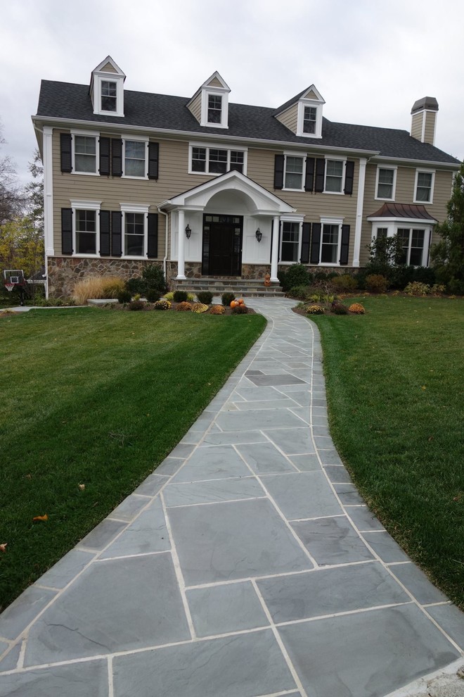 Home design - large traditional home design idea in New York