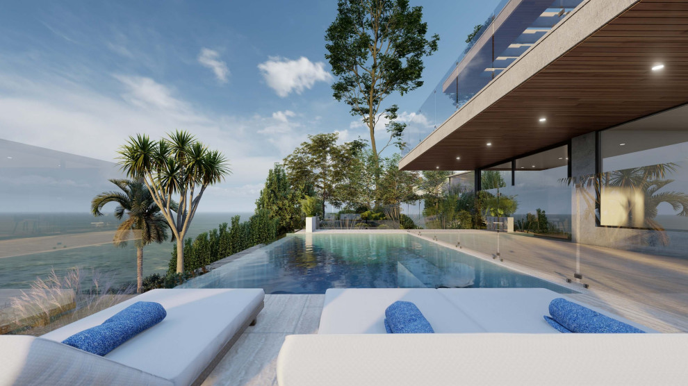 Diseño de piscina infinita costera con adoquines de piedra natural