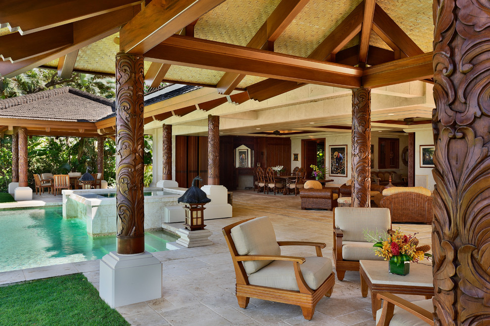 Design ideas for a large tropical patio in Hawaii with a gazebo/cabana, a water feature and natural stone pavers.
