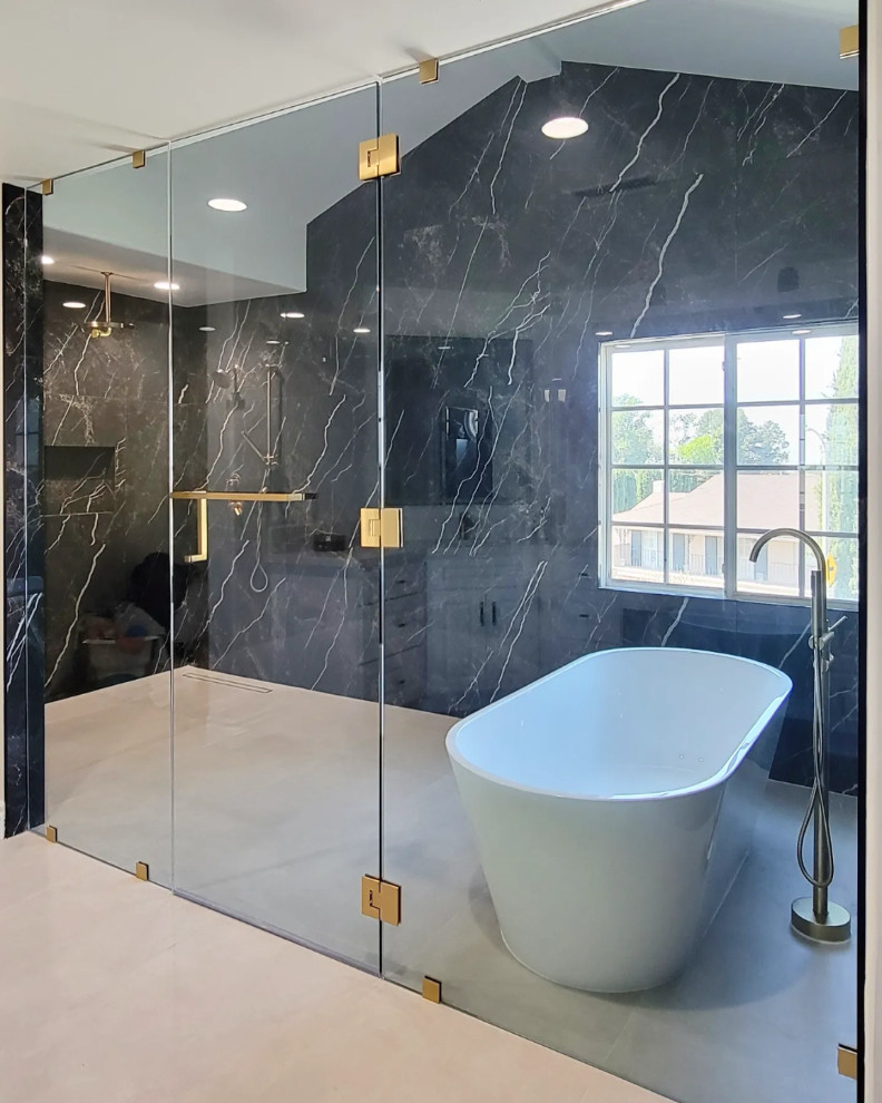 Large minimalist master black and white tile porcelain tile and gray floor bathroom photo in Orange County with black walls, a hinged shower door and a niche