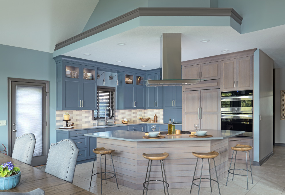 Eat-in kitchen - large transitional l-shaped gray floor eat-in kitchen idea in New York with an undermount sink, quartz countertops, multicolored backsplash, paneled appliances, an island, gray countertops, recessed-panel cabinets and blue cabinets