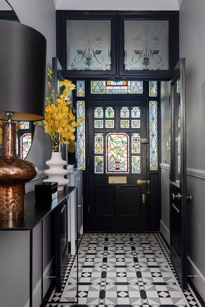 Design ideas for a traditional entrance in London with grey walls, a single front door, a black front door, multi-coloured floors, wainscoting and a dado rail.