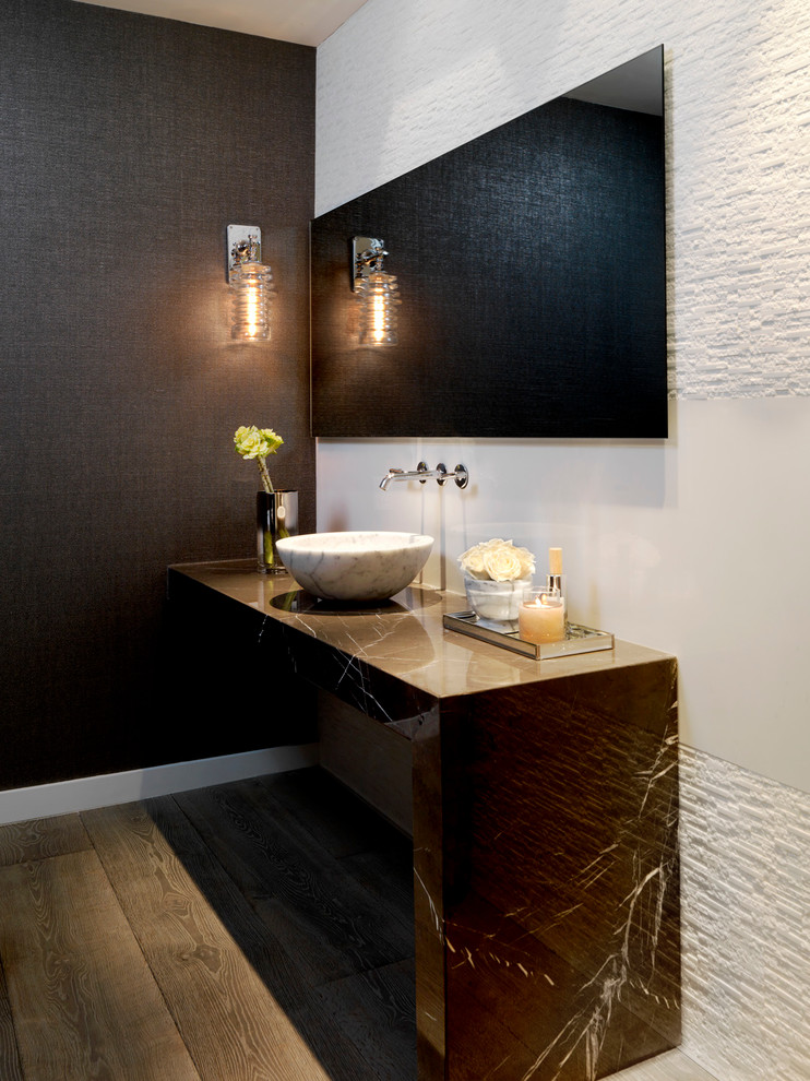 Contemporary powder room in Miami with a vessel sink, white tile, black walls, dark hardwood floors and brown benchtops.