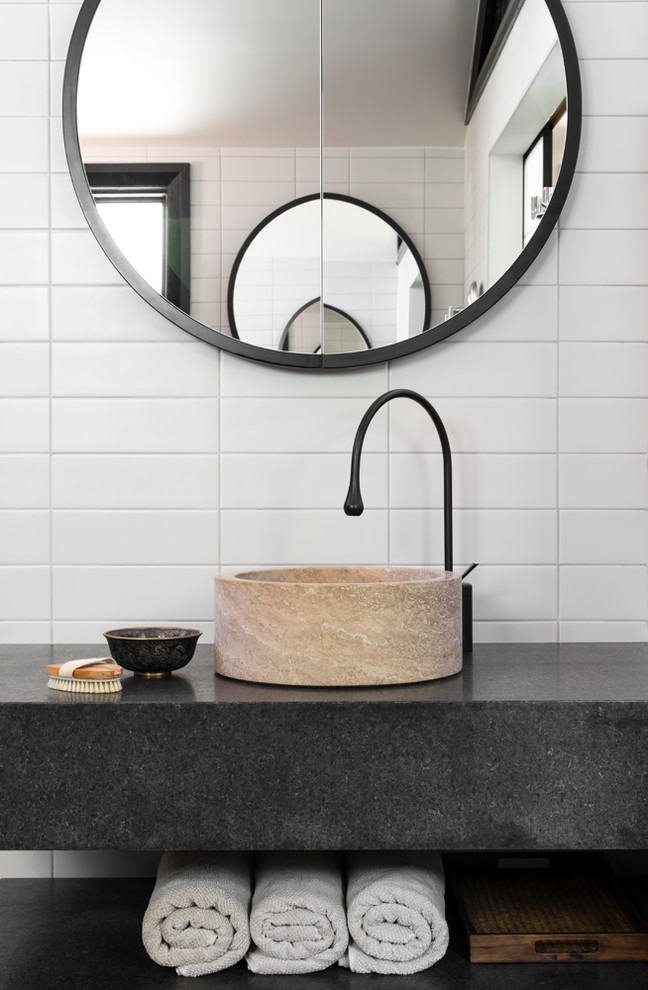 Photo of a contemporary powder room in Sydney with a vessel sink, white tile, subway tile and grey benchtops.