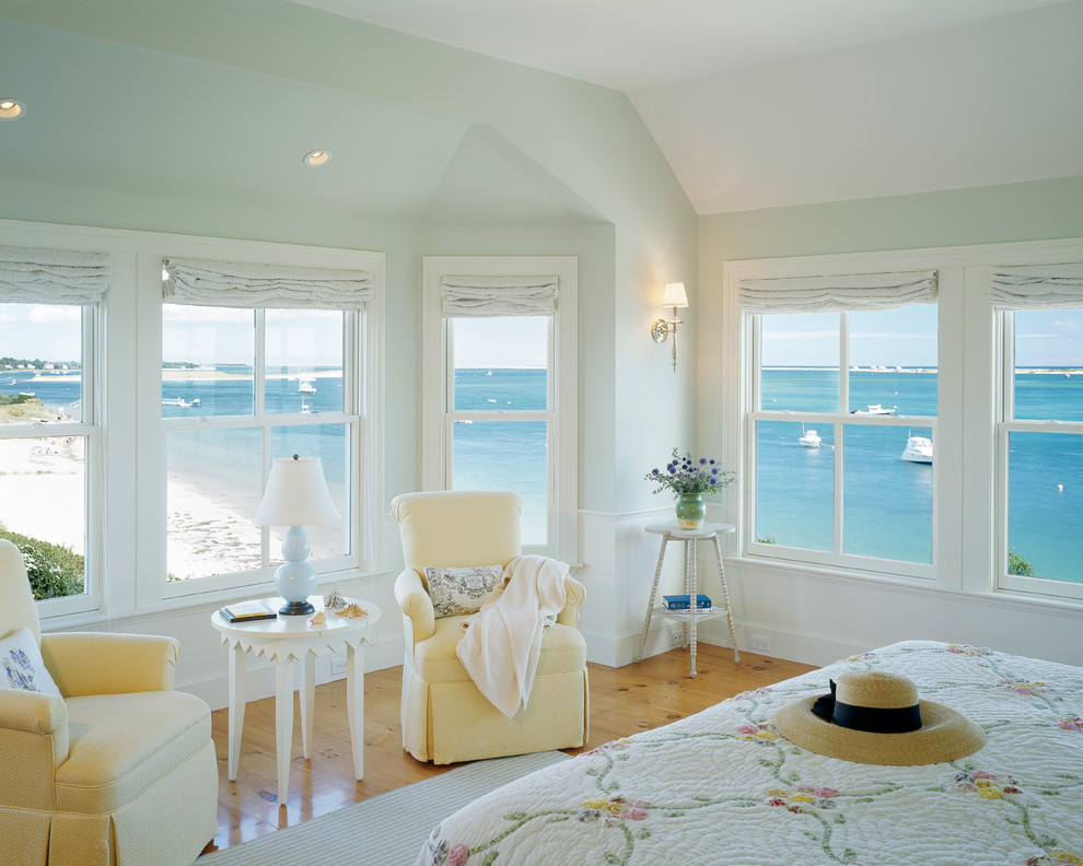 This is an example of a beach style bedroom in Boston with yellow floor.