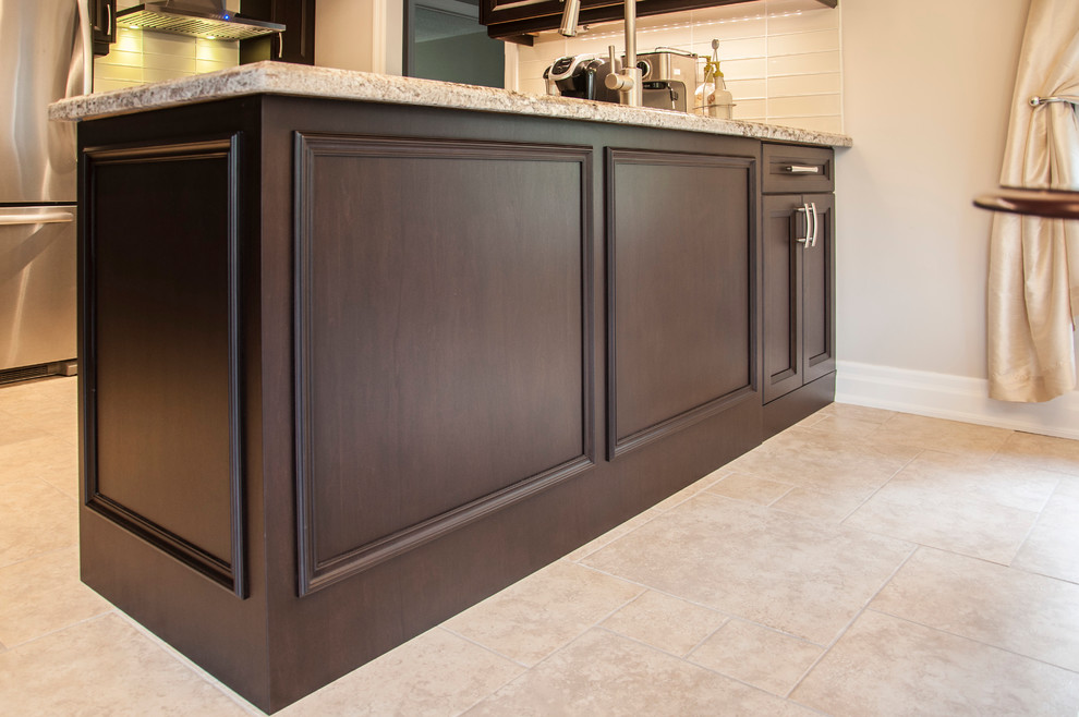 Example of a transitional kitchen design in Toronto