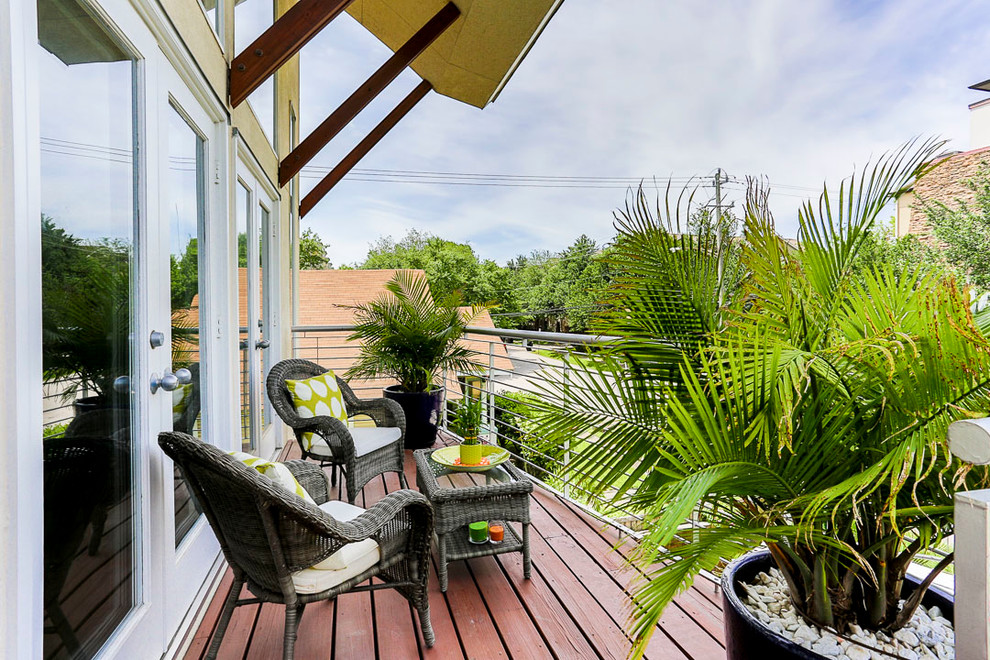 Design ideas for a tropical balcony in Houston with an awning.