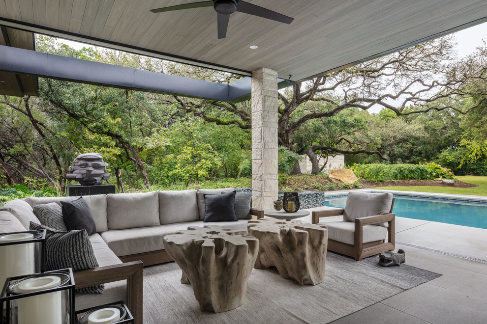 Design ideas for a contemporary patio in Austin with a roof extension.