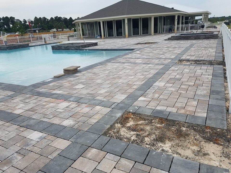 Hot tub - large transitional backyard stone and custom-shaped natural hot tub idea in Miami