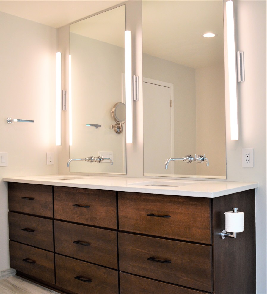 Large modern master bathroom in Milwaukee with flat-panel cabinets, dark wood cabinets, a double shower, a wall-mount toilet, gray tile, white tile, porcelain tile, beige walls, engineered quartz benchtops, grey floor, an open shower and white benchtops.