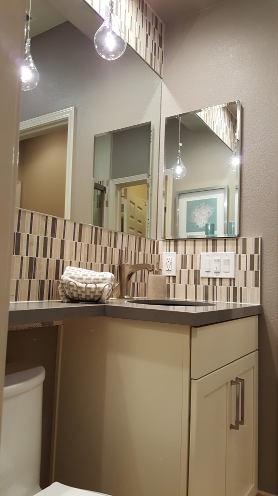 This is an example of a small eclectic 3/4 bathroom in San Francisco with shaker cabinets, white cabinets, an alcove shower, a one-piece toilet, beige tile, porcelain tile, grey walls, limestone floors, an undermount sink, engineered quartz benchtops, beige floor, a sliding shower screen, grey benchtops, a shower seat, a single vanity and a built-in vanity.