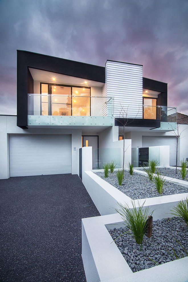 Inspiration for a contemporary two-storey multi-coloured duplex exterior in Melbourne with a flat roof.