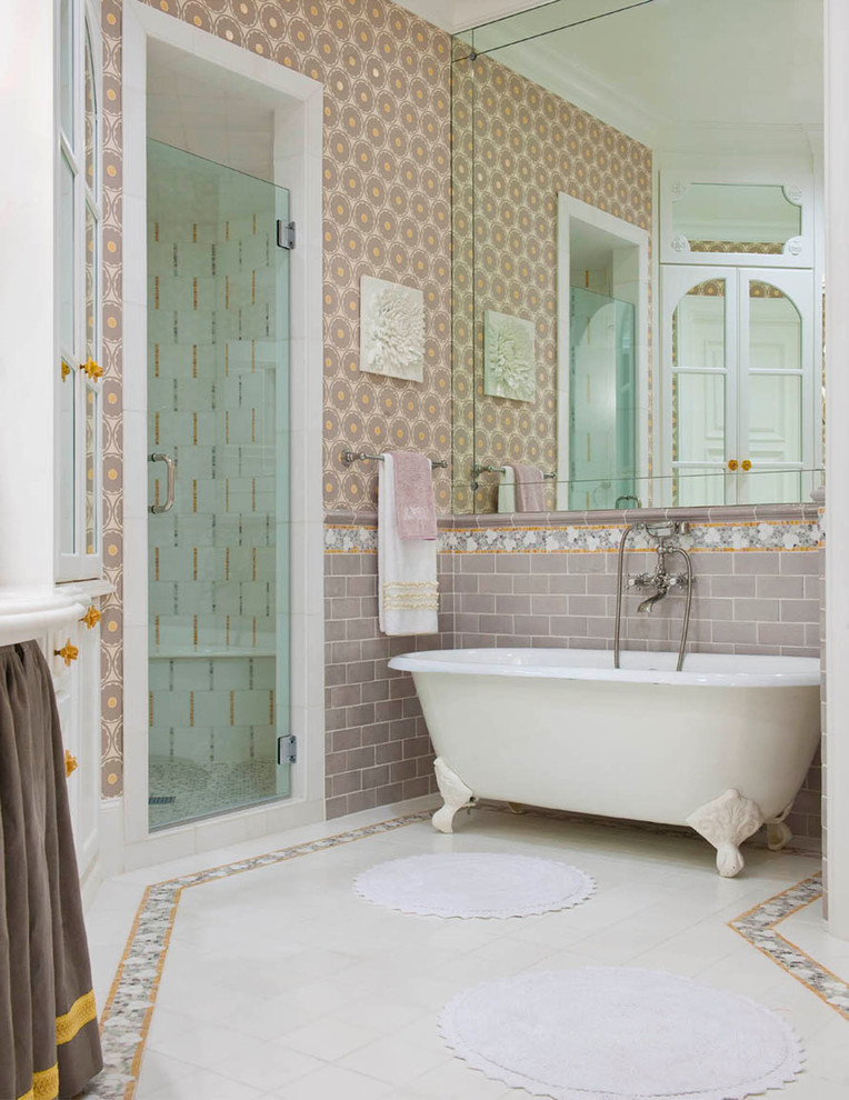 This is an example of a traditional bathroom in Dallas with a claw-foot tub, an alcove shower and multi-coloured tile.