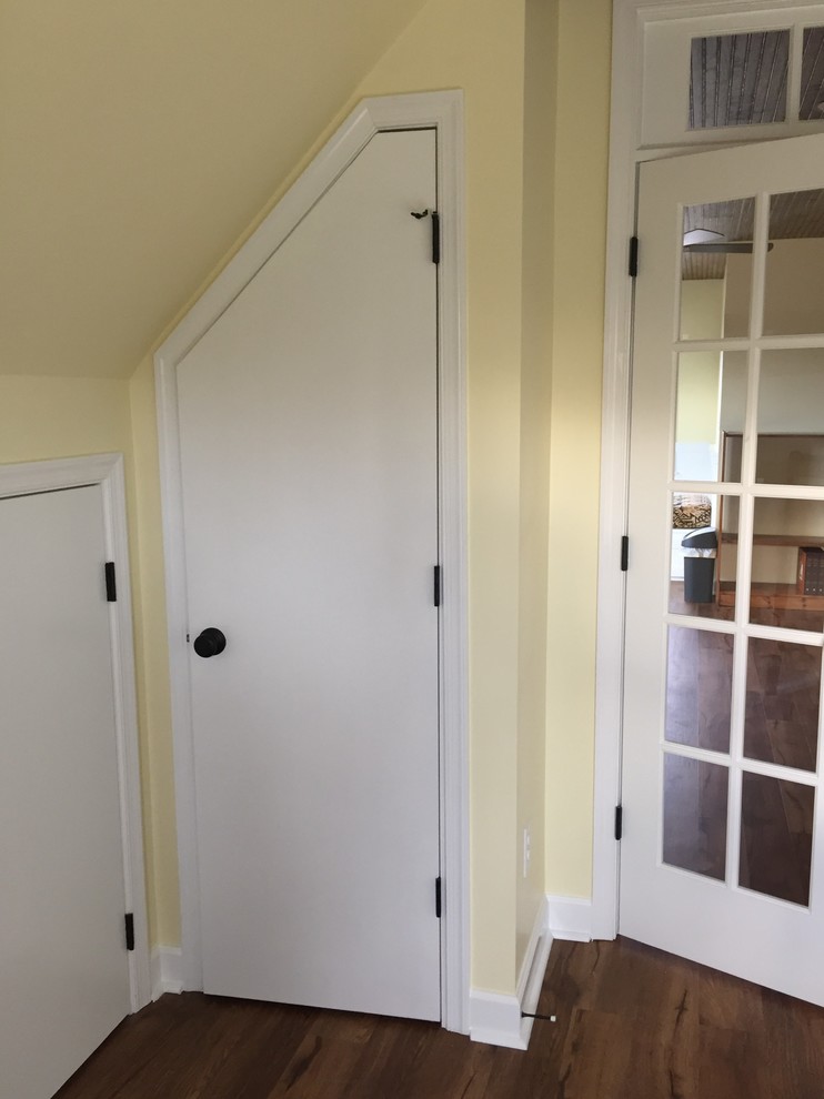 Inspiration for a large timeless loft-style vinyl floor home design remodel with yellow walls