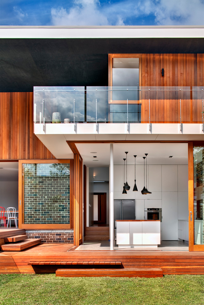 Design ideas for a contemporary exterior in Sydney with wood siding.