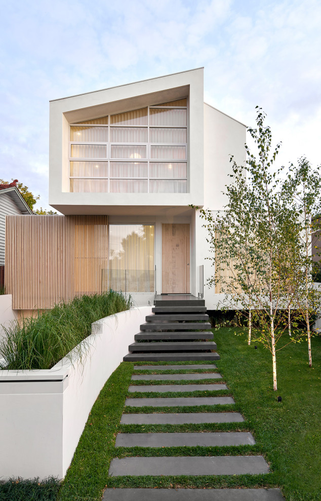 Design ideas for a contemporary two-storey white house exterior in Melbourne.