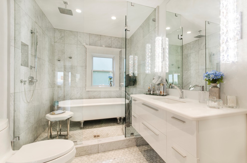 Mid-sized transitional master wet room bathroom in Vancouver with flat-panel cabinets, white cabinets, a claw-foot tub, gray tile, porcelain tile, porcelain floors, an undermount sink, engineered quartz benchtops, grey floor, a hinged shower door, white benchtops and a one-piece toilet.