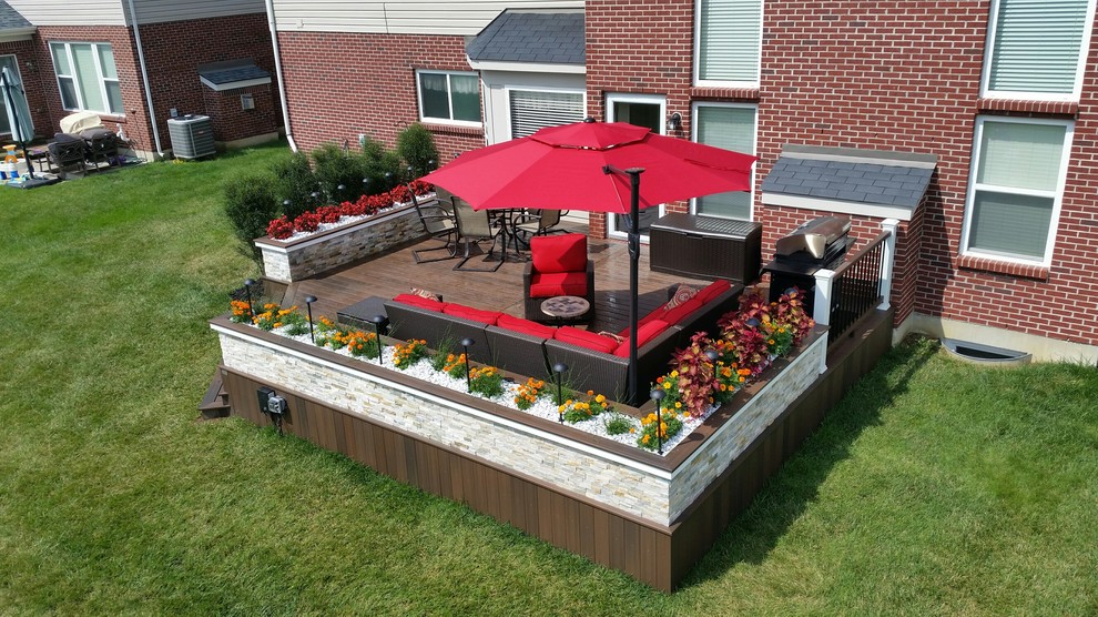 Large elegant backyard deck photo with no cover