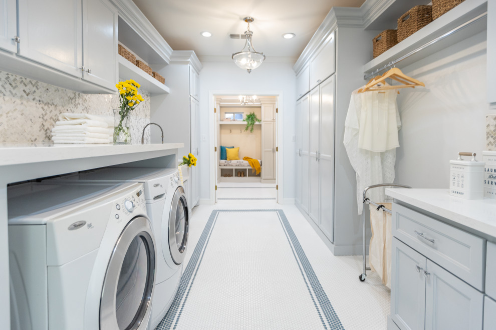 Contemporary laundry room in Tampa with a farmhouse sink, shaker cabinets, blue cabinets, quartzite benchtops, multi-coloured splashback, marble splashback, blue walls, porcelain floors and white floor.