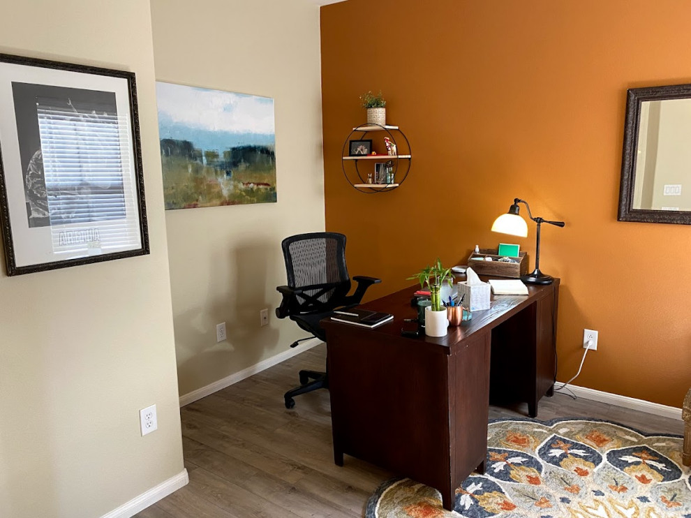 Design ideas for a medium sized bohemian study in Las Vegas with orange walls, vinyl flooring, no fireplace, a freestanding desk and grey floors.