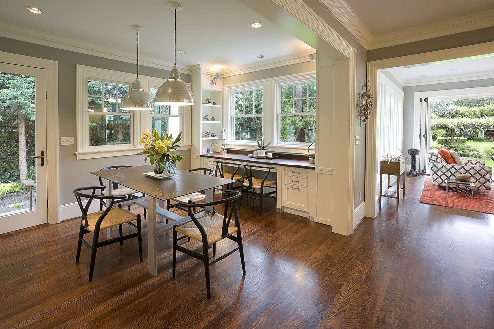 Photo of a traditional dining room in Portland with grey walls and dark hardwood floors.