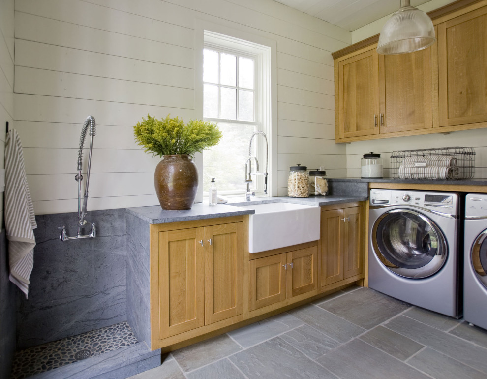 This is an example of a transitional laundry room in Atlanta.