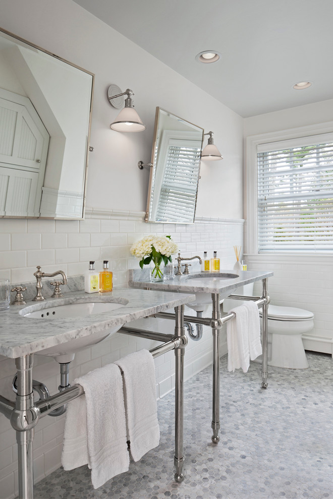 Mid-sized beach style master bathroom in Other with a console sink, marble benchtops, a two-piece toilet, white tile, subway tile, white walls and mosaic tile floors.