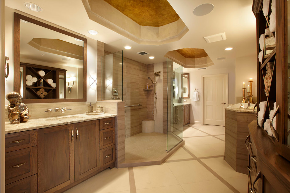 This is an example of an expansive transitional master bathroom in Miami with shaker cabinets, dark wood cabinets, an alcove tub, an open shower, a one-piece toilet, beige tile, porcelain tile, beige walls, porcelain floors, an undermount sink, granite benchtops, multi-coloured floor and an open shower.