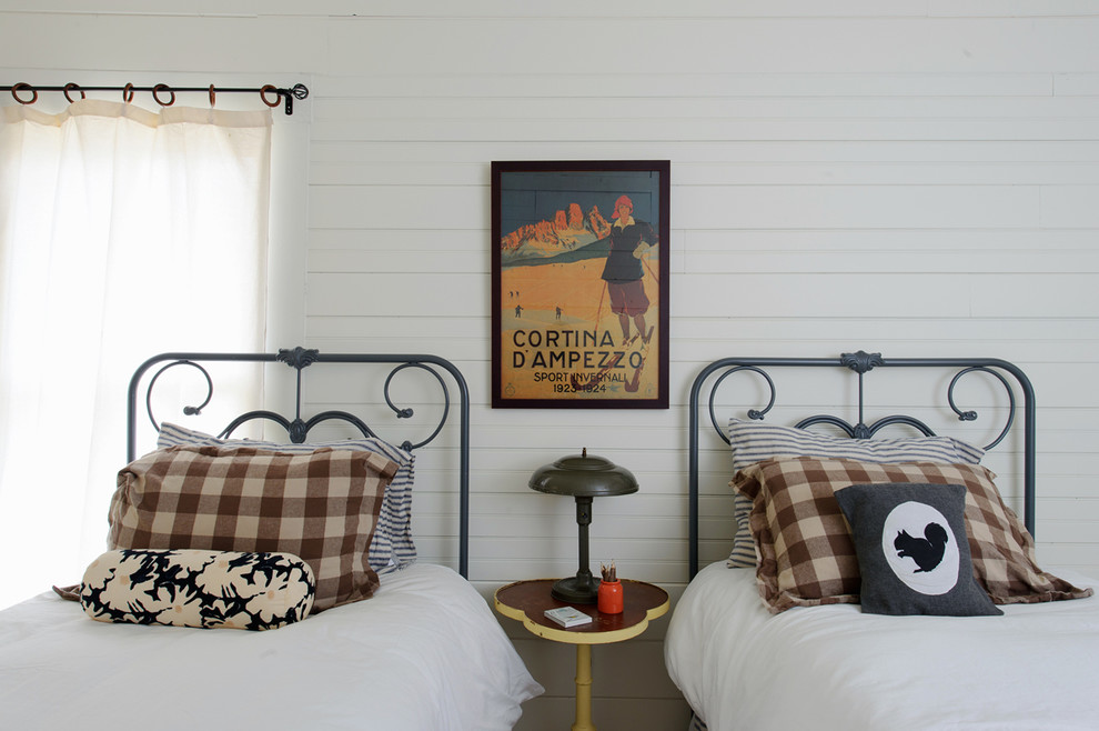 Eclectic guest bedroom in Other with white walls.