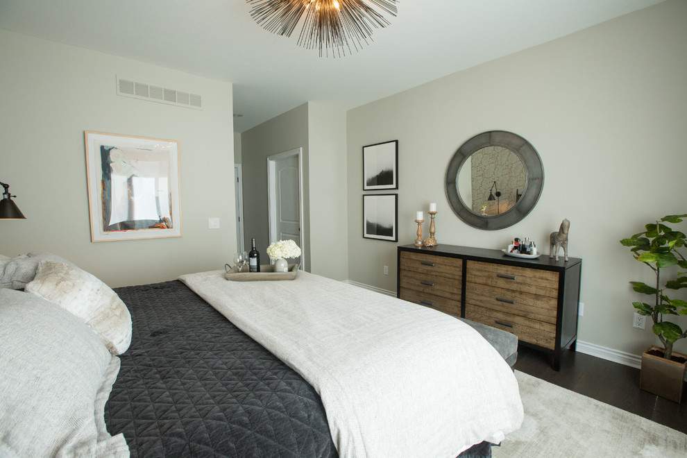 This is an example of a mid-sized eclectic master bedroom in Other with grey walls, dark hardwood floors and brown floor.