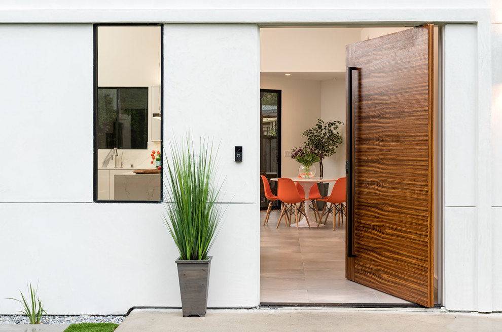 Design ideas for a modern front door in Sacramento with white walls and a single front door.