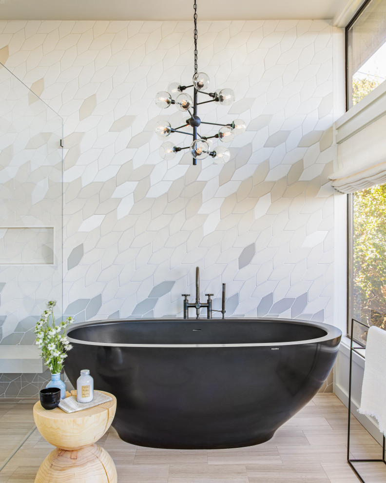 Design ideas for a large contemporary cream and black ensuite bathroom in San Francisco with a freestanding bath, a built-in shower, beige tiles, grey tiles and beige floors.