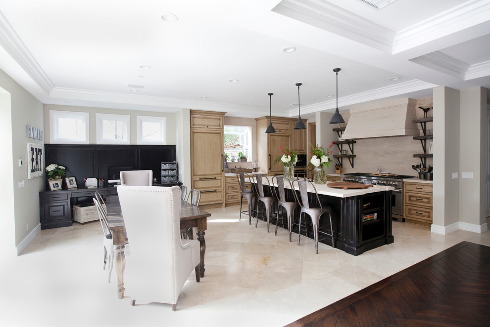 Large transitional u-shaped porcelain tile and beige floor open concept kitchen photo in Orange County with a double-bowl sink, recessed-panel cabinets, medium tone wood cabinets, limestone countertops, beige backsplash, stainless steel appliances, an island, limestone backsplash and beige countertops