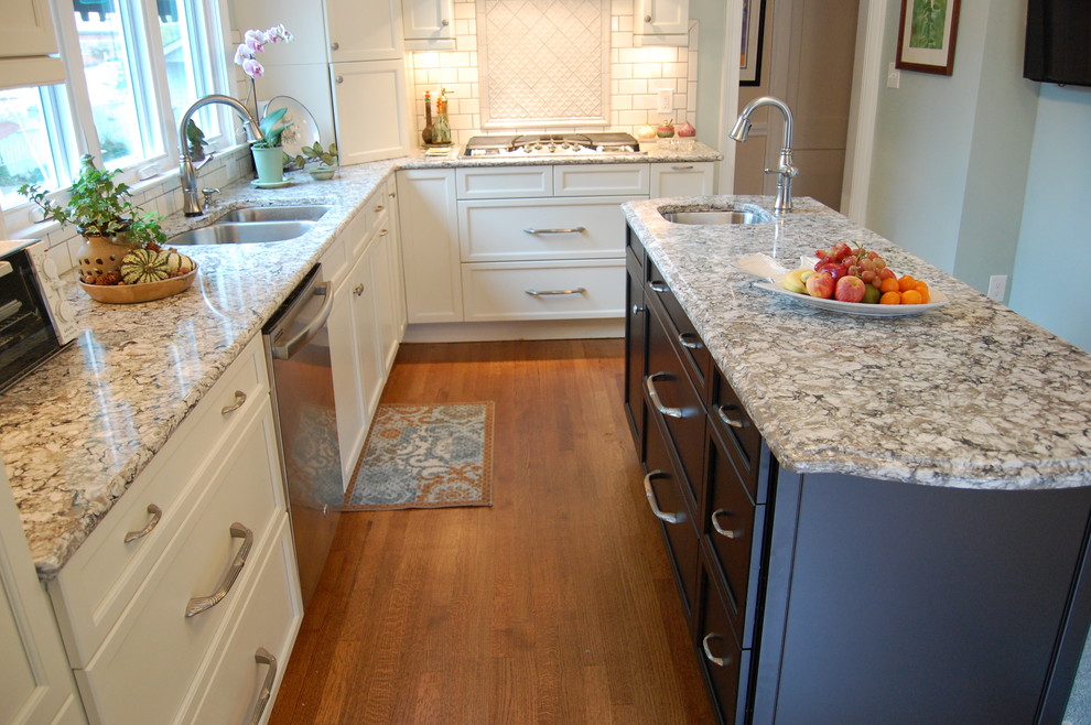 Inspiration for a transitional u-shaped eat-in kitchen remodel in Raleigh with an undermount sink, recessed-panel cabinets, white cabinets, quartzite countertops, white backsplash, subway tile backsplash and stainless steel appliances