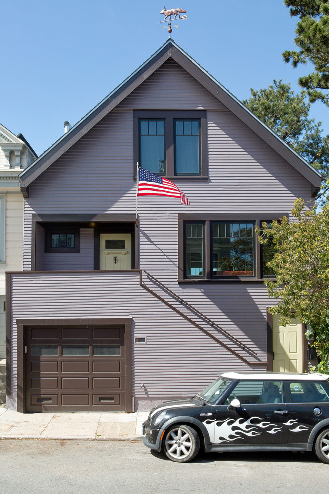 Photo of a mid-sized traditional three-storey purple house exterior in San Francisco with wood siding, a gable roof and a shingle roof.