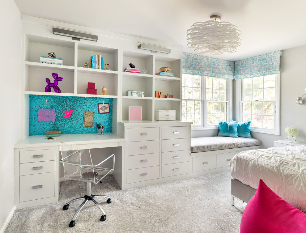 This is an example of a transitional kids' room for girls in New York with grey walls, carpet and grey floor.