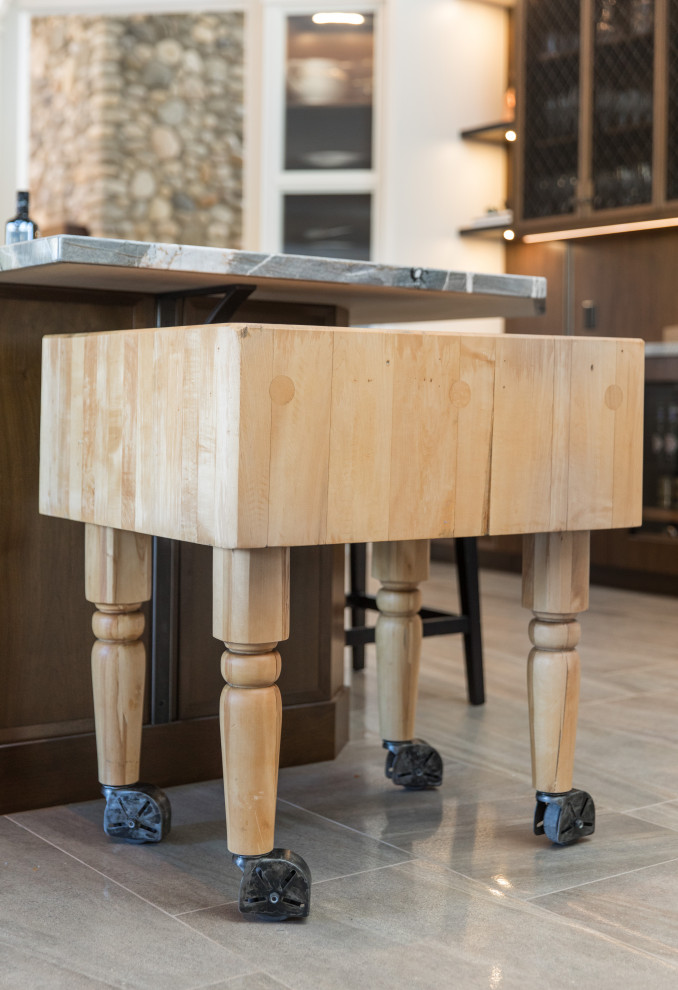Example of a transitional home design design in Calgary