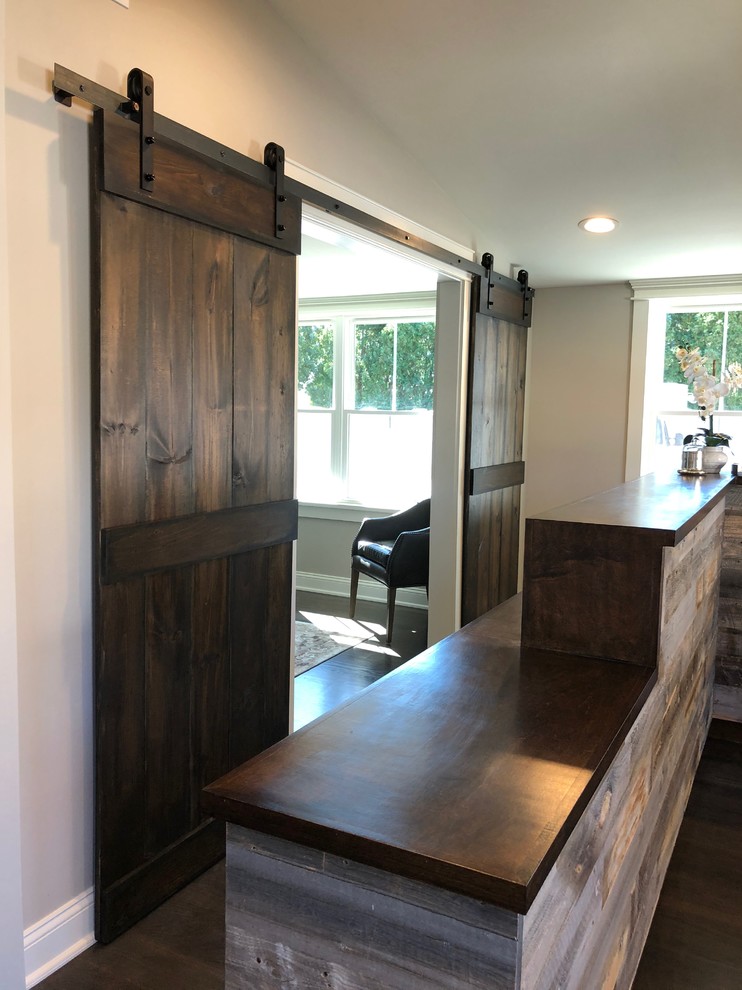 Hallway - mid-sized transitional dark wood floor and brown floor hallway idea with gray walls