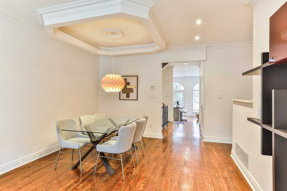 Transitional dining room photo in Toronto