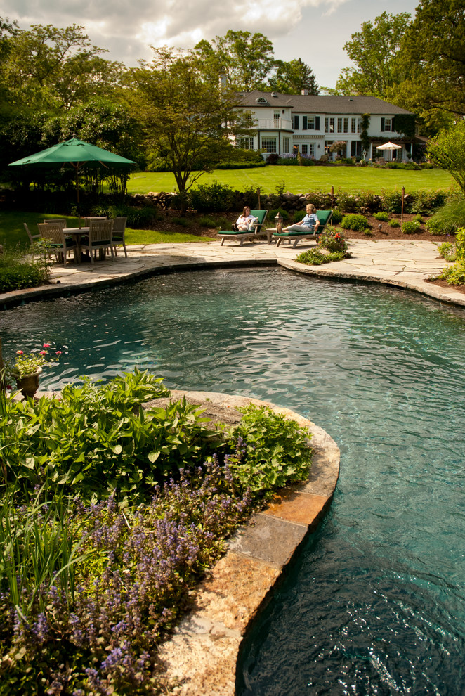 This is an example of a traditional custom-shaped pool in New York.
