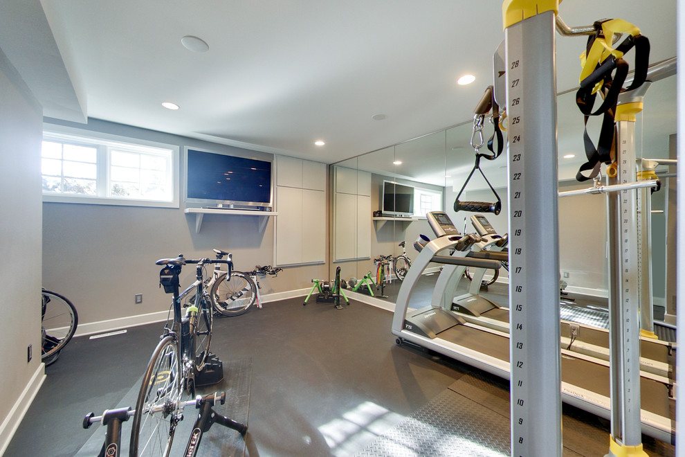 Small contemporary home weight room in Minneapolis with grey walls, concrete floors and grey floor.