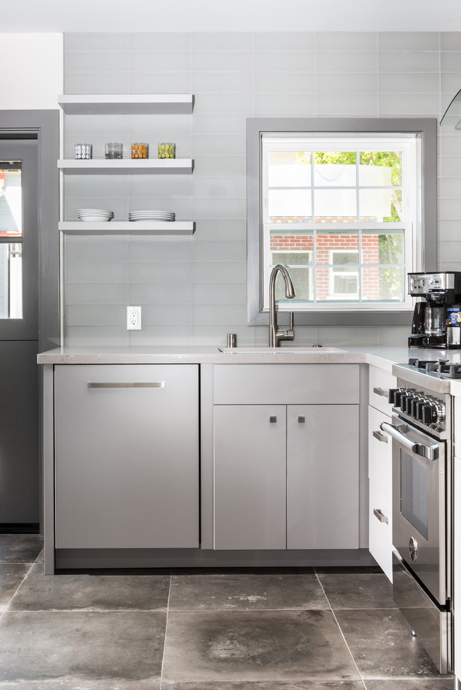 Inspiration for a small contemporary l-shaped eat-in kitchen in Los Angeles with an undermount sink, flat-panel cabinets, grey cabinets, quartz benchtops, white splashback, stainless steel appliances, ceramic floors, no island and beige benchtop.