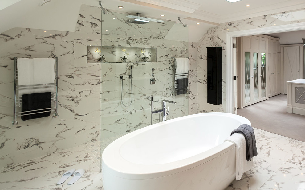 Inspiration for a contemporary master bathroom in Sussex with a freestanding tub, a curbless shower, white tile and marble floors.