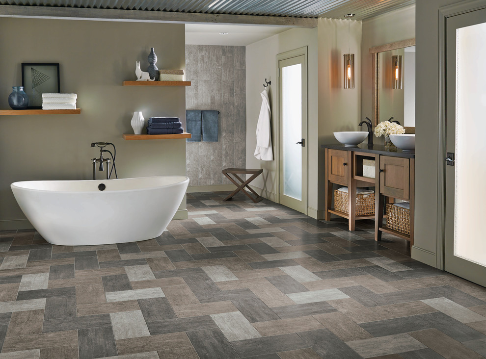 Inspiration for a large transitional master freestanding bathtub remodel with shaker cabinets, medium tone wood cabinets and a vessel sink