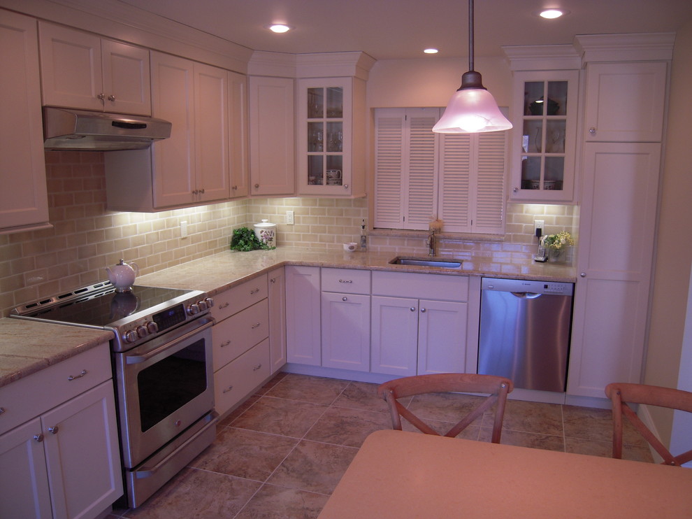 Example of a transitional kitchen design in New York